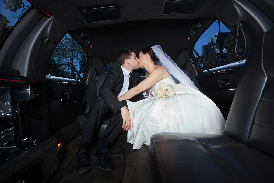 Newlywed Couple in Limousine